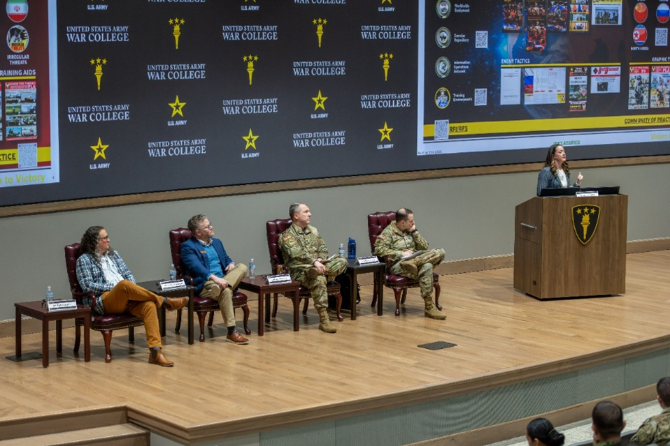 Ms. Jennifer Dunn, a T2COM G-2 senior analyst, opens the USAWC student event on March 24.