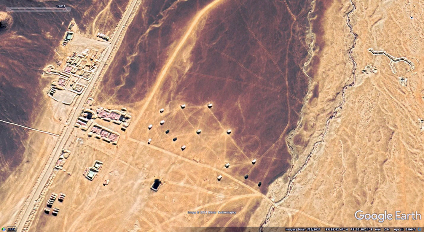 Company fighting formation of armored vehicles south of Spanggur Lake in front of its fortified field camp (note trenches dug in valley floor on right), January 2021