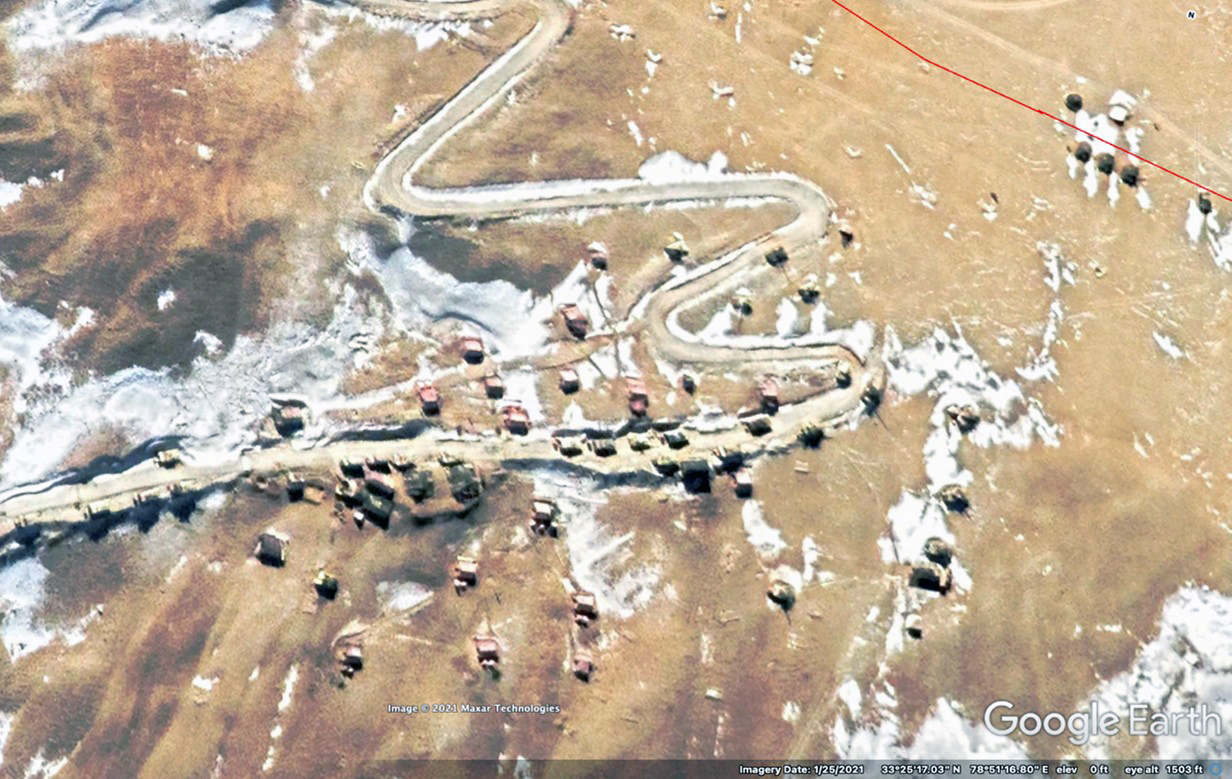 PLA outpost on LAC at Rechin La before negotiated withdrawal (note armored vehicles and trucks on road in front of tents on hillside); Indian position (upper right) January 2021